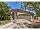 Attractive single-story house with a two-car garage and desert landscaping at 2727 S 160Th Ln, Goodyear, AZ 85338