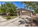 Attractive single-story house with a two-car garage and desert landscaping at 2727 S 160Th Ln, Goodyear, AZ 85338