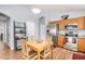 Kitchen with wood cabinets, stainless steel appliances, and breakfast table at 2727 S 160Th Ln, Goodyear, AZ 85338