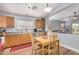 The eat-in kitchen offers wood cabinets, light countertops and stainless dishwasher at 2727 S 160Th Ln, Goodyear, AZ 85338
