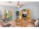 Cozy living room with hardwood floors and sliding glass doors leading to the backyard at 2727 S 160Th Ln, Goodyear, AZ 85338