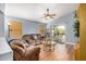 Cozy living room with hardwood floors and sliding glass doors leading to the backyard at 2727 S 160Th Ln, Goodyear, AZ 85338
