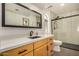 Modern bathroom with a sleek countertop, stylish fixtures, and a frameless glass shower in a neutral color palette at 2834 S Extension Rd # 2001, Mesa, AZ 85210