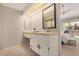 Bright vanity area leading into the main bedroom with white cabinets, generous counter space, and natural light at 2834 S Extension Rd # 2001, Mesa, AZ 85210