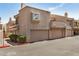 This townhome has an attached garage, desert landscaping, and well-maintained exterior at 2834 S Extension Rd # 2001, Mesa, AZ 85210