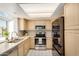 Well-lit kitchen featuring stainless steel appliances, generous counter space, and a bright window with neighborhood views at 2834 S Extension Rd # 2001, Mesa, AZ 85210