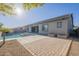 Backyard featuring a pool, spa, covered patio, and well-maintained landscaping at 28917 N 66Th Ave, Phoenix, AZ 85083