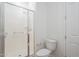 Bright bathroom featuring a spacious walk-in shower with glass door and a modern toilet at 28917 N 66Th Ave, Phoenix, AZ 85083