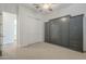 Bedroom with a Murphy bed, closet, and neutral carpet at 28917 N 66Th Ave, Phoenix, AZ 85083