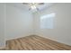 Cozy bedroom with a ceiling fan, light-colored walls, and a window at 28917 N 66Th Ave, Phoenix, AZ 85083