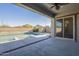 A covered patio overlooking a pool and spa, and views of the surrounding landscape at 28917 N 66Th Ave, Phoenix, AZ 85083