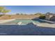 Backyard pool with a spa, surrounded by brick wall and desert landscaping at 28917 N 66Th Ave, Phoenix, AZ 85083