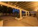 Outdoor space featuring a covered patio with lights, built-in planters, BBQ, and cornhole area at 300 E Moore Ave, Gilbert, AZ 85234