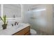 Modern bathroom with stylish vanity, marble countertop, and glass-enclosed shower at 300 E Moore Ave, Gilbert, AZ 85234