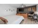 Modern bedroom with wooden furnishings, neutral color scheme, and decorative artwork at 300 E Moore Ave, Gilbert, AZ 85234