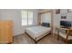 Bedroom featuring a Murphy bed, desk, and neutral décor at 300 E Moore Ave, Gilbert, AZ 85234