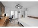 Spacious bedroom featuring a desk, chair, and light-filled windows and closet at 300 E Moore Ave, Gilbert, AZ 85234