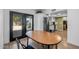 Cozy dining area with backyard access, adjacent to the kitchen, featuring modern appliances and ample counter space at 300 E Moore Ave, Gilbert, AZ 85234