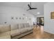 Bright and airy living room with a high ceiling, natural light, and comfortable sofa, perfect for relaxation at 300 E Moore Ave, Gilbert, AZ 85234