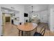 Open-concept living space with dining area, fireplace, and bright natural light at 300 E Moore Ave, Gilbert, AZ 85234