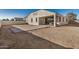 House backyard featuring patio and neutral landscaping at 30003 W Rockmount Ave, Buckeye, AZ 85396