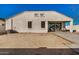 Spacious backyard featuring a covered patio and low-maintenance desert landscaping, perfect for outdoor living at 30003 W Rockmount Ave, Buckeye, AZ 85396