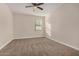 Bright bedroom featuring neutral paint, plush carpeting, and natural light at 30003 W Rockmount Ave, Buckeye, AZ 85396