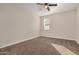 Bright bedroom featuring neutral paint, plush carpeting, and a ceiling fan for comfort at 30003 W Rockmount Ave, Buckeye, AZ 85396
