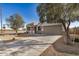Attractive single-story home featuring a two-car garage and desert landscaping on a corner lot at 30003 W Rockmount Ave, Buckeye, AZ 85396