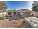 Beautiful single-story home with a desert-landscaped front yard, two-car garage, and lovely curb appeal at 30003 W Rockmount Ave, Buckeye, AZ 85396