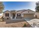 Charming single-story home featuring a two-car garage, desert landscaping, and a welcoming entryway at 30003 W Rockmount Ave, Buckeye, AZ 85396