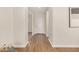 Clean and bright entryway with wood-look flooring and white walls at 30003 W Rockmount Ave, Buckeye, AZ 85396
