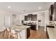 Beautiful kitchen with a large island, granite countertops, and modern appliances at 30003 W Rockmount Ave, Buckeye, AZ 85396