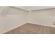 Walk-in closet with neutral paint, plush carpeting, and simple open shelving at 30003 W Rockmount Ave, Buckeye, AZ 85396