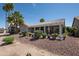 Charming backyard with a covered patio, providing a relaxing outdoor living space amidst desert landscaping at 3070 N 148Th Dr, Goodyear, AZ 85395