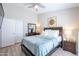 Bedroom featuring a ceiling fan, neutral walls, and sliding closet doors at 3070 N 148Th Dr, Goodyear, AZ 85395