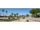 Picturesque community view featuring mature landscaping, a lush green and manicured common areas, and a serene atmosphere at 3070 N 148Th Dr, Goodyear, AZ 85395