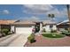 Charming single-story home with a well-manicured front yard and a two-car garage in a sunny locale at 3070 N 148Th Dr, Goodyear, AZ 85395