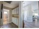 Hallway with chandelier and view into a bathroom with tiled shower and vanity at 3070 N 148Th Dr, Goodyear, AZ 85395
