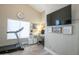 Bright home gym with modern fitness equipment, including a treadmill and motivational wall art at 3070 N 148Th Dr, Goodyear, AZ 85395