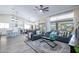Bright living room with an open floorplan featuring a view of the kitchen and dining room at 3070 N 148Th Dr, Goodyear, AZ 85395