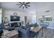 A spacious and inviting living room features a ceiling fan and an open floor plan, perfect for entertaining at 3070 N 148Th Dr, Goodyear, AZ 85395