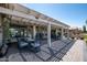 Outdoor patio with ample seating and a covered pergola, perfect for entertaining or enjoying the desert scenery at 3070 N 148Th Dr, Goodyear, AZ 85395