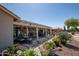 Inviting covered patio with dining area, perfect for outdoor relaxation and entertaining, surrounded by lush landscaping at 3070 N 148Th Dr, Goodyear, AZ 85395