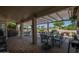 Spacious covered patio perfect for outdoor dining and relaxation overlooking the golf course at 3070 N 148Th Dr, Goodyear, AZ 85395