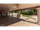 Large, covered back patio with pillars, ceiling fans, and a grill at 3203 E Ellis St, Mesa, AZ 85213