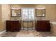 Elegant bathroom featuring dual vanities, mirrors, and a window at 3203 E Ellis St, Mesa, AZ 85213