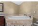 Close up of a bathtub with tile surround in a primary bathroom at 3203 E Ellis St, Mesa, AZ 85213