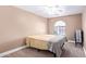 Bedroom with neutral carpet, large window, neutral walls, and a queen bed at 3203 E Ellis St, Mesa, AZ 85213