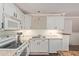 Bright kitchen showcases white cabinets, stainless steel appliances, and ample counter space at 3203 E Ellis St, Mesa, AZ 85213